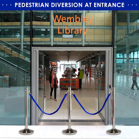 Blue Velvet Stanchion Rope With Polished Gold Hooks 4 Pack securing entrance at Wembley Library, crowd control setup visible.