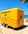 Mobile Food Truck And Snack Cart For Sale Featuring Custom Commercial Trailer Built For Coffee Stands And Burger Joints Heavy Duty Street Vendor Rig Ready To Hustle with yellow exterior on a beach.