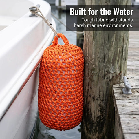 Orange Solid Nylon Boat Fenders For Docking And Marine Anti Collision Protection positioned on dock with boat