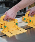 Killer Table Saw 3D Grip Pushblock With Dead Solid Kickback Stopping Guard and Sliding Blade Shield, yellow, stabilizing narrow wood strips.