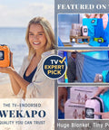 Sandproof And Waterproof Beach Blanket 7x7 Ft Extra Large Mat With Stakes displayed in TV segments and held compact in orange pouch