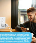 Lock Down Your Wall Outlet With This Tug Proof Charger Lock That Attaches Via Heavy Duty Security Screw To Block Sneaky Tugs And Keep Dual Charging Cables Locked Tight Forever, shown on a wall with a user.