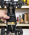 Adjustable Metal RC Drive Shaft for 1/12 Scale Crawlers installed in MN82 model, showing telescoping 70mm-93mm length, silver part