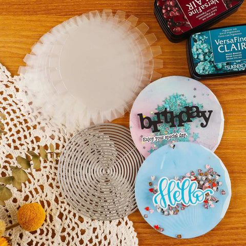 Flat Shaker Covers and Nesting Circle Dies with acetate sheets for shaker card making and scrapbooking on a wooden table.