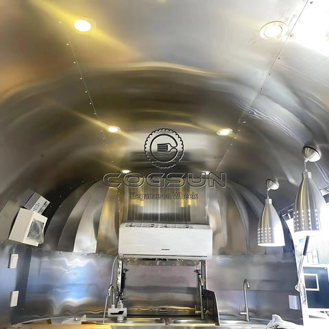 Interior view of Built Different Stainless Steel Food Truck With Fully Loaded Commercial Kitchen featuring sleek stainless steel design.