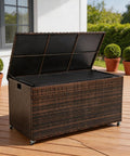 Boss Grade 170 Gallon Outdoor Deck Box Crafted From Durable Wicker Rattan With Smooth Roll Wheels, opened top for storage.