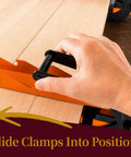 Close-up of hand using 36 Inch Pressure Panel Clamp System Set, Heavy Duty Steel Clamps 2 Pack, on wooden panels