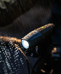 Lars Rover Power 850 USB Rechargeable Bicycle Headlight With Battery Meter, 5 Modes, in the rain, mounted on a bike
