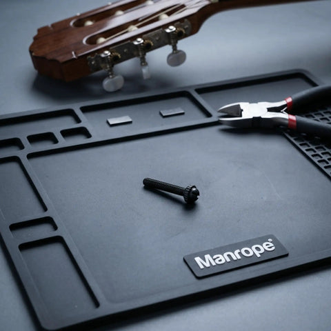 Black M2.5x18.5mm Tuner Peg Screws And Washers For Classical Guitar Machine Heads on workspace with tools and guitar.