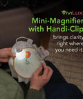 Person using Pro Grade Optical 3X Magnifier with Handi-Clip and Flexible Arm attached to embroidery hoop for precise detail work.