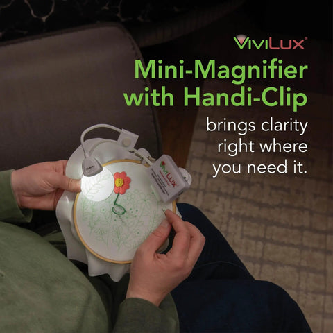 Person using Pro Grade Optical 3X Magnifier with Handi-Clip and Flexible Arm attached to embroidery hoop for precise detail work.