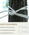 Two Person Portable Camping Hammock Bed With Anti Roll Balance Beam And Tree Straps, tree strap tied around tree trunk