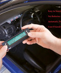 Hands holding SG2 Ultra Compact 3 In 1 Automotive Computer With Real Time Fuel Economy Gauges near car dashboard
