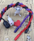 Three Pack Silk Look Rope 32 Ft Each 8mm Soft Braided Satin Rope Multi Color Black Red Purple For Crafts DIY Home Decor Projects Party Decor Gift Wrapping And Multipurpose Use intertwined with figurines