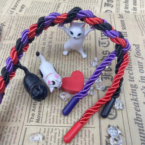 Three Pack Silk Look Rope 32 Ft Each 8mm Soft Braided Satin Rope Multi Color Black Red Purple For Crafts DIY Home Decor Projects Party Decor Gift Wrapping And Multipurpose Use intertwined with figurines