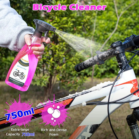 Person spraying a bike with a 750ml Bicycle Cleaner from the Bike Chain Cleaner Kit With Bicycle Cleaner Degreaser Lubricant And 12 Piece Cleaning Set For Mountain Road MTB And E Bikes Clean Degrease Lube Your Chain Like A Pro.