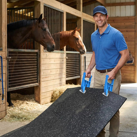 Man using Heavy Duty Horse Stall Mat Grippers Set Of 2, Serrated Grip For Tight Fit And Easy Move, Slippage Free Handling, Mat Lifter Tool To Shift Large Carpets Safely, Durable Stall Flooring Accessory For Quick Adjustments on a rubber mat in a horse stall