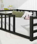 Black Safe Toddler Floor Bed With Rails And Door Full Size Montessori Bed For Ages 2 To 5, pillows and toys in image.