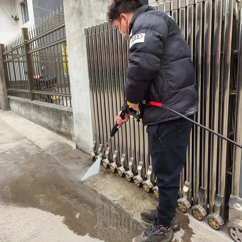 Person using Adjustable Length High Power Washer Gun 5000 PSI With Foam Cannon And Quick-Change Nozzles All-In-One Pressure Washer Accessory Kit
