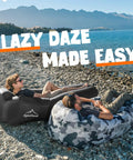 Inflatable Lounger With Carry Bag For Beach And Camping, Air Sofa Hammock Couch For Outdoors on rocky lakeside beach.