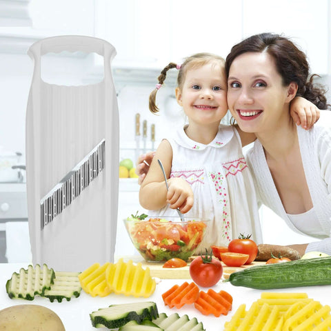 Börner Wave-Waffle XXL PowerLine white crinkle-cut vegetable slicer on kitchen counter with assorted sliced vegetables.