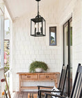 Heck Of A Solid Knockout Outdoor And Indoor Pendant Light With Sleek Black Steel Build And Clear Glass Shade Straight Upgrade For Front Porch Foyer Entryway Ceiling Mount Adjustable Chain hanging above a porch console.