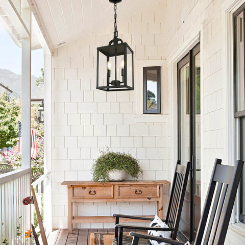 Heck Of A Solid Knockout Outdoor And Indoor Pendant Light With Sleek Black Steel Build And Clear Glass Shade Straight Upgrade For Front Porch Foyer Entryway Ceiling Mount Adjustable Chain hanging above a porch console.