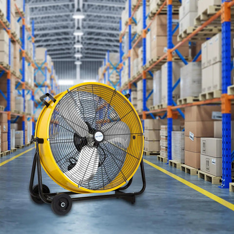 Beast Mode High Velocity Industrial Drum Fan 24 Inch With 8100 CFM in a warehouse aisle for cooling large spaces.