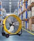 24 Inch High Velocity Drum Fan With 8100 CFM Three Speed Beefy Heavy Duty Tilt Floor Shop Fan in warehouse aisle