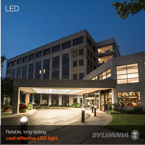 Exterior view of a modern building illuminated by Top Shelf LED HIDR Replacement Bulb 24 Watt A23 bollard fixtures.