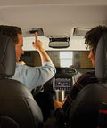 Couple inside car using 3 Button Garage Door Remote Compatible With Up To 3 Openers, In Vehicle Access LED indicator