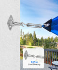 Close-up of Built Tough All-In-One Sun Shade Sail Hardware Kit with M5 stainless steel hooks attached to blue sail on patio wall.