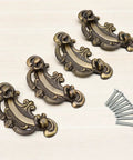 Four Vintage Look Bail Drawer Pulls 2.5 Inch Center To Center Dark Antique Bronze Cabinet Handles with screws on a light background