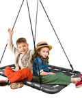Outdoor Platform Swing For Kids With Rectangular Mat Chair For Tree Or Swing Set Playground Includes Accessories 40 By 30 Inches Black Rectangle with two children sitting on it, enjoying playful moments.