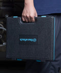 Person holding organized storage case for 76 Piece Tap And Die Set For Metric And Standard Threads Rethreading Kit.