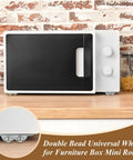 16 Piece Clear Self Adhesive Appliance Casters Featuring Dual Steel Ball Rollers For Pain Free Heavy Gadget Moving Straight Up Game Changer Kitchen Counter Savers under a microwave on a wooden countertop.
