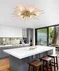 Gold Sputnik Ceiling Light Fixture 12 Light Firework Chandelier Semi Flush Mount in a modern kitchen interior.