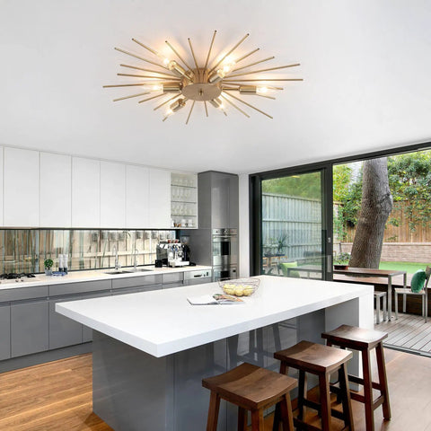Gold Sputnik Ceiling Light Fixture 12 Light Firework Chandelier Semi Flush Mount in a modern kitchen interior.
