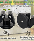 Heavy Duty Magnetic Mop And Broom Holder Rack with adjustable idler wheel design, attached to a white washing machine.