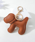 Premium Faux Leather Dog Bag Charm With Sturdy Metal Keyring for Trendy Handbags, featuring a cute brown dog design.