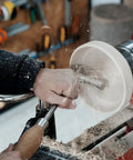 Woodworker using a stainless steel S shaped tool rest set for woodturning lathe bowls with 9 inch internal crossbar.