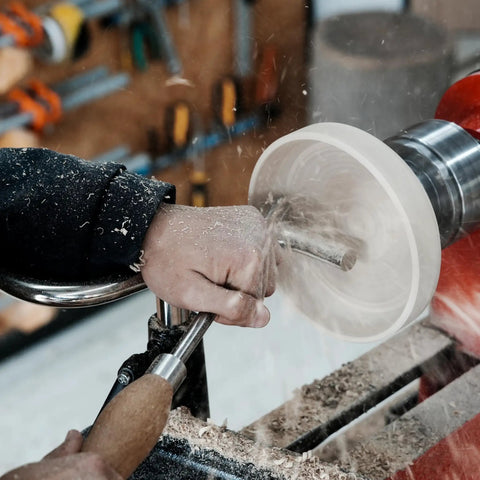 Woodworker using a stainless steel S shaped tool rest set for woodturning lathe bowls with 9 inch internal crossbar.
