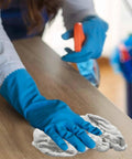 Person cleaning a wooden surface with Premium White Terry Cloth Rags For Spills And Cleanup In The Garage Shop And Home Go To Multipurpose