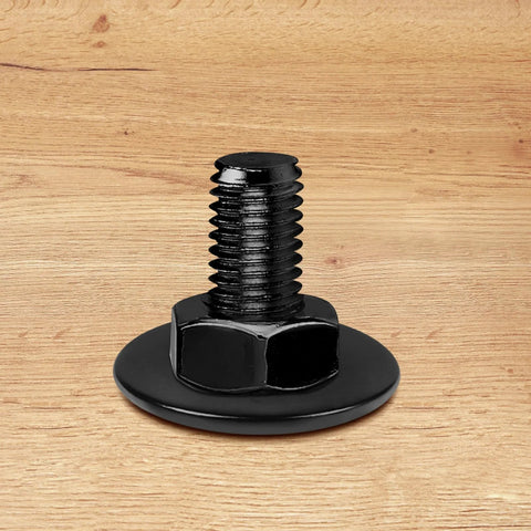 Front view of black stainless steel bolt with flat washer on wood surface