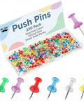 Bulk Assorted Push Pins For Bulletin Boards Featuring Hella Bright Plastic Heads And Sharp Metal Tips in a clear box, showing assorted colors.