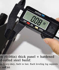 Caliper measuring 0.08 inches thickness of heavy duty adjustable leveling feet 4 pack black furniture levelers.