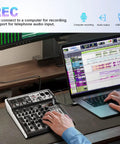Person using 4 Channel Karaoke DJ Mixer With Bluetooth USB Audio Interface 16 Bit DSP Effects Plus 48V Phantom Power connected to laptop