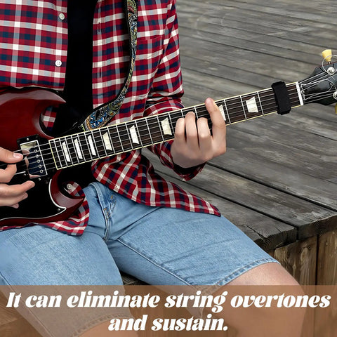 Musician using 2 Pack Guitar String Dampener Set With Fret Mutes And Bass Muffler Silencer Damper, playing electric guitar.