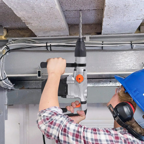 Worker using Heavy Duty SDS Max Rotary Hammer Drill With Vibration Control And Safety Clutch 13 Amp Powerhouse for concrete ceiling