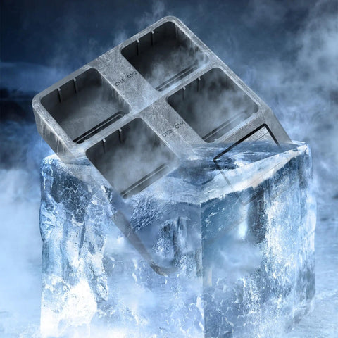 Ice cube tray resting on block of ice with foggy background